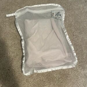 Pink ollie swaddle with laundry bag